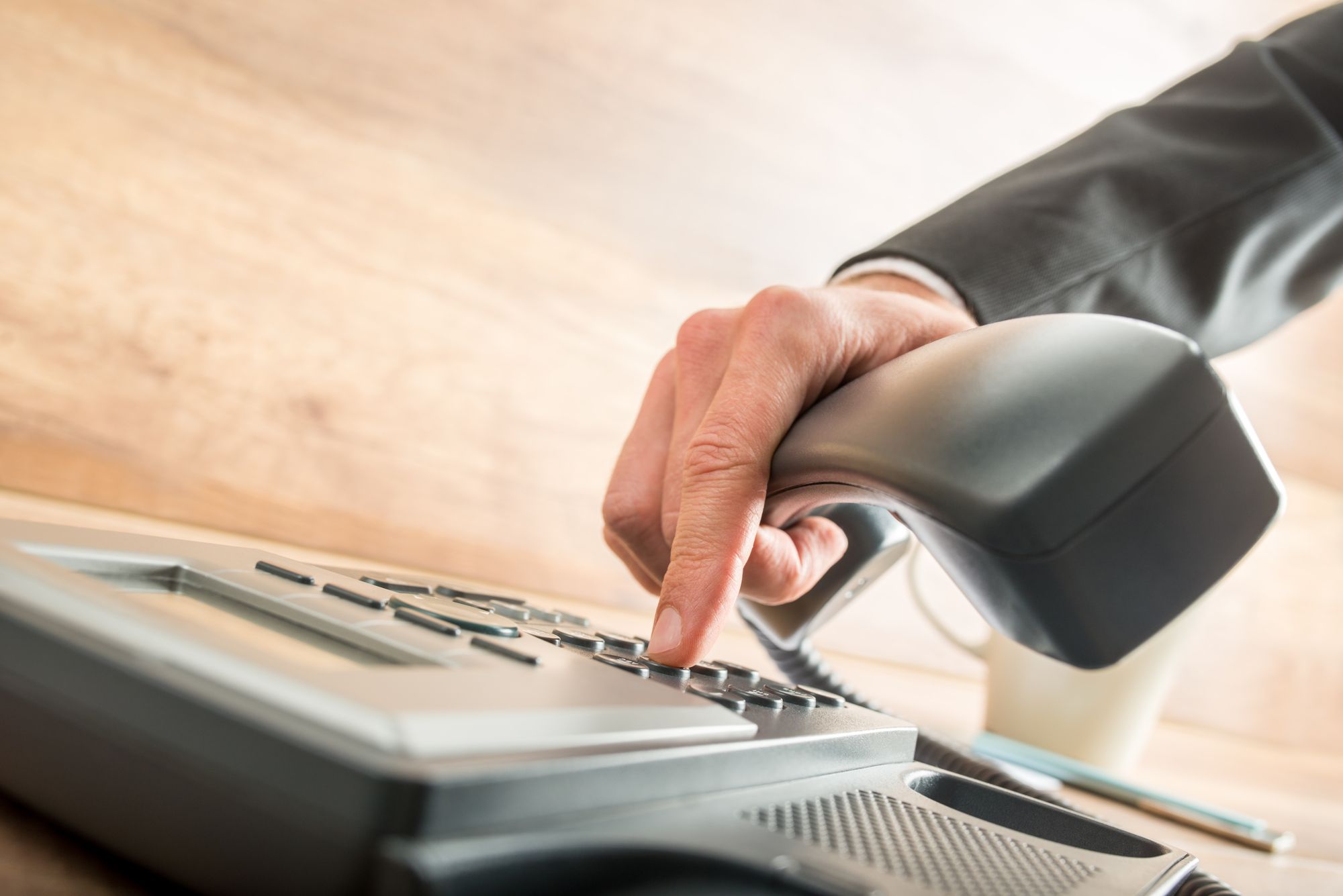 someone dialing an office phone