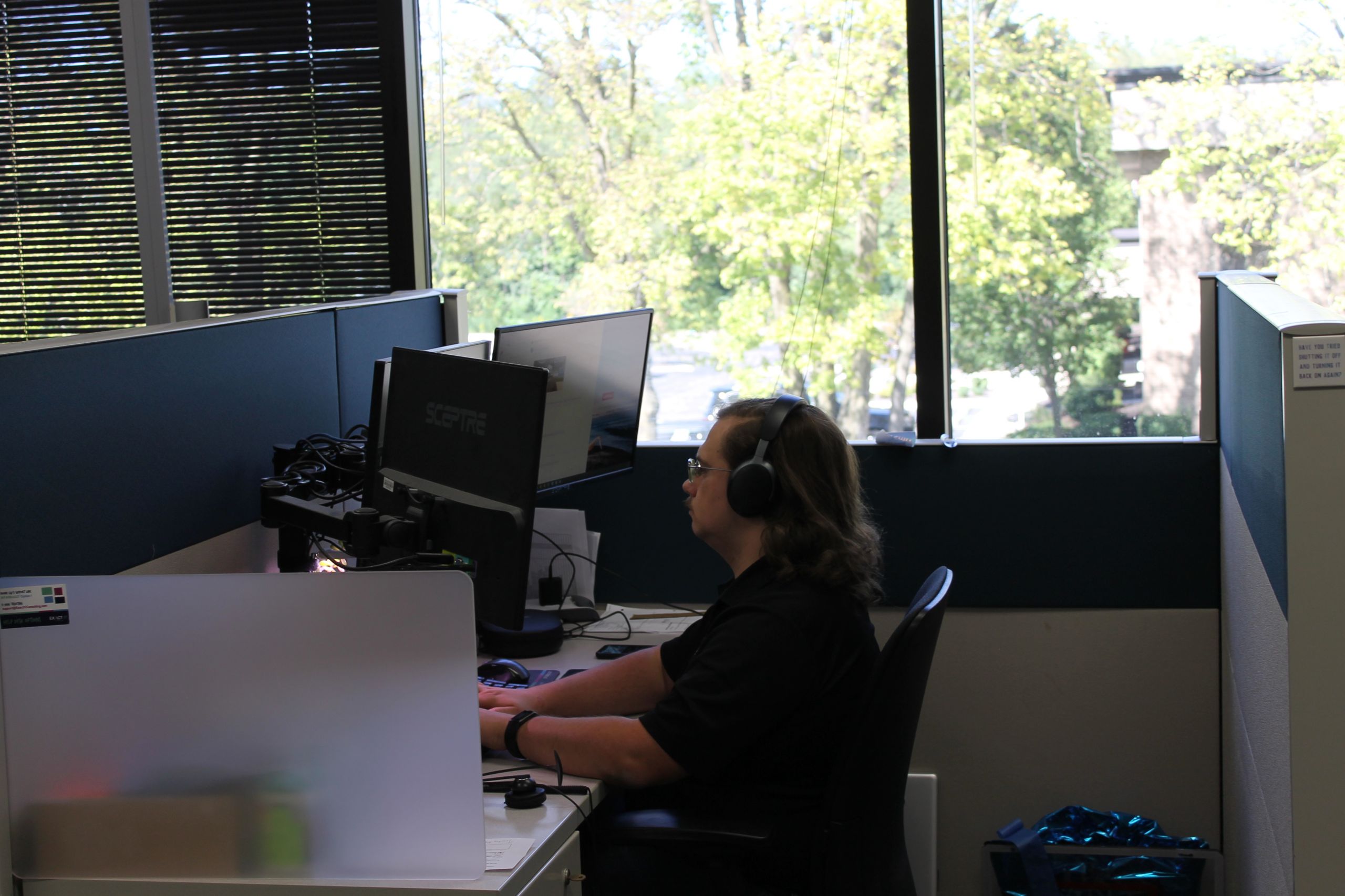 Exact IT Member working at his desk.