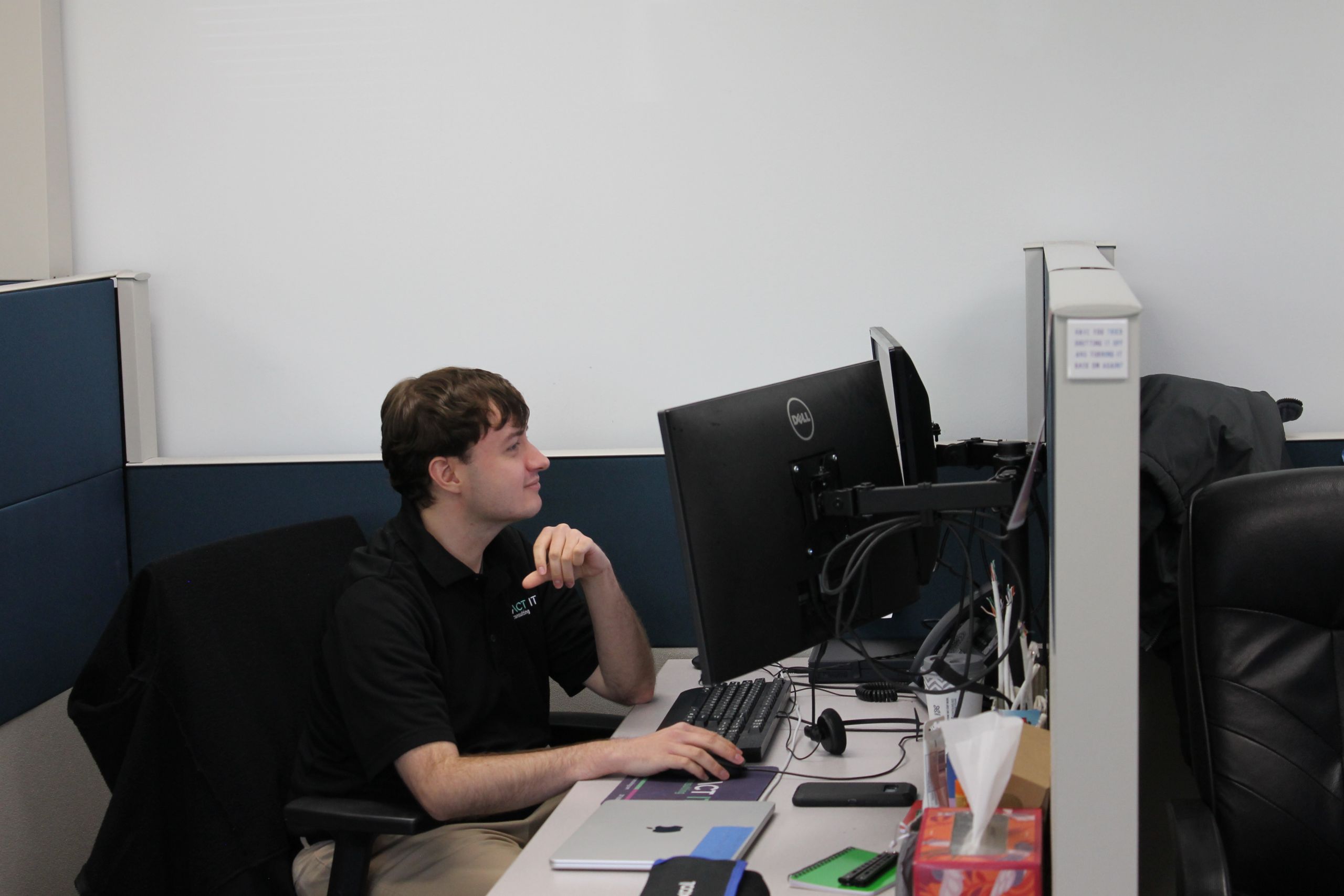 Exact IT Member working at his desk.