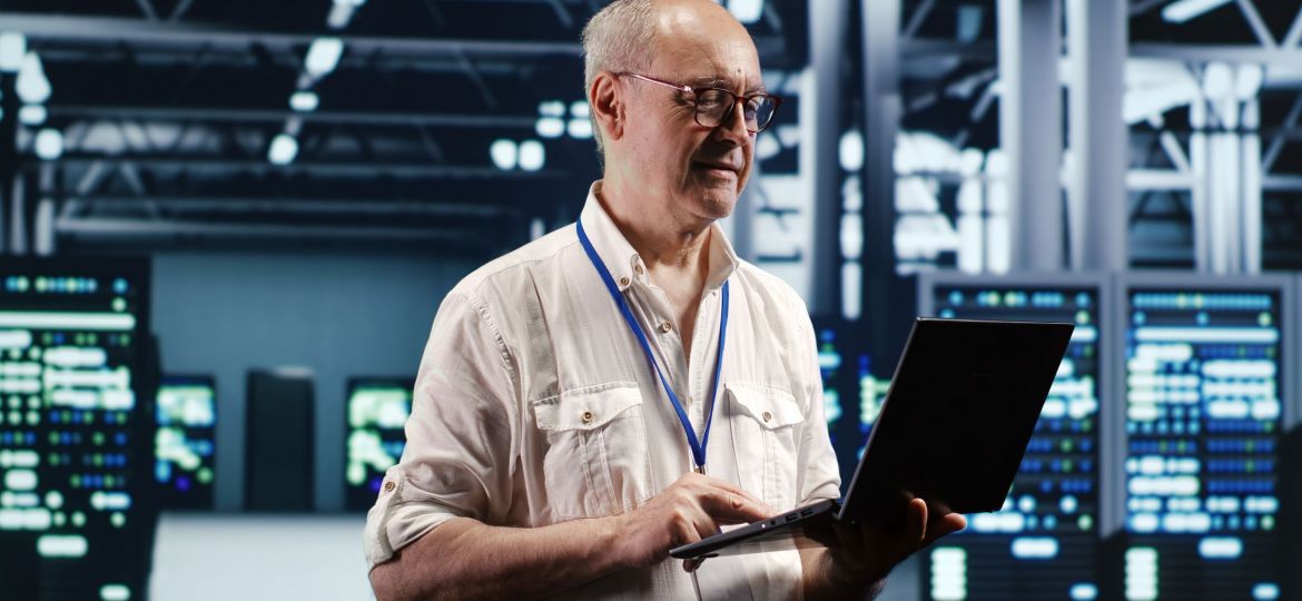 IT Service Member, using a laptop.