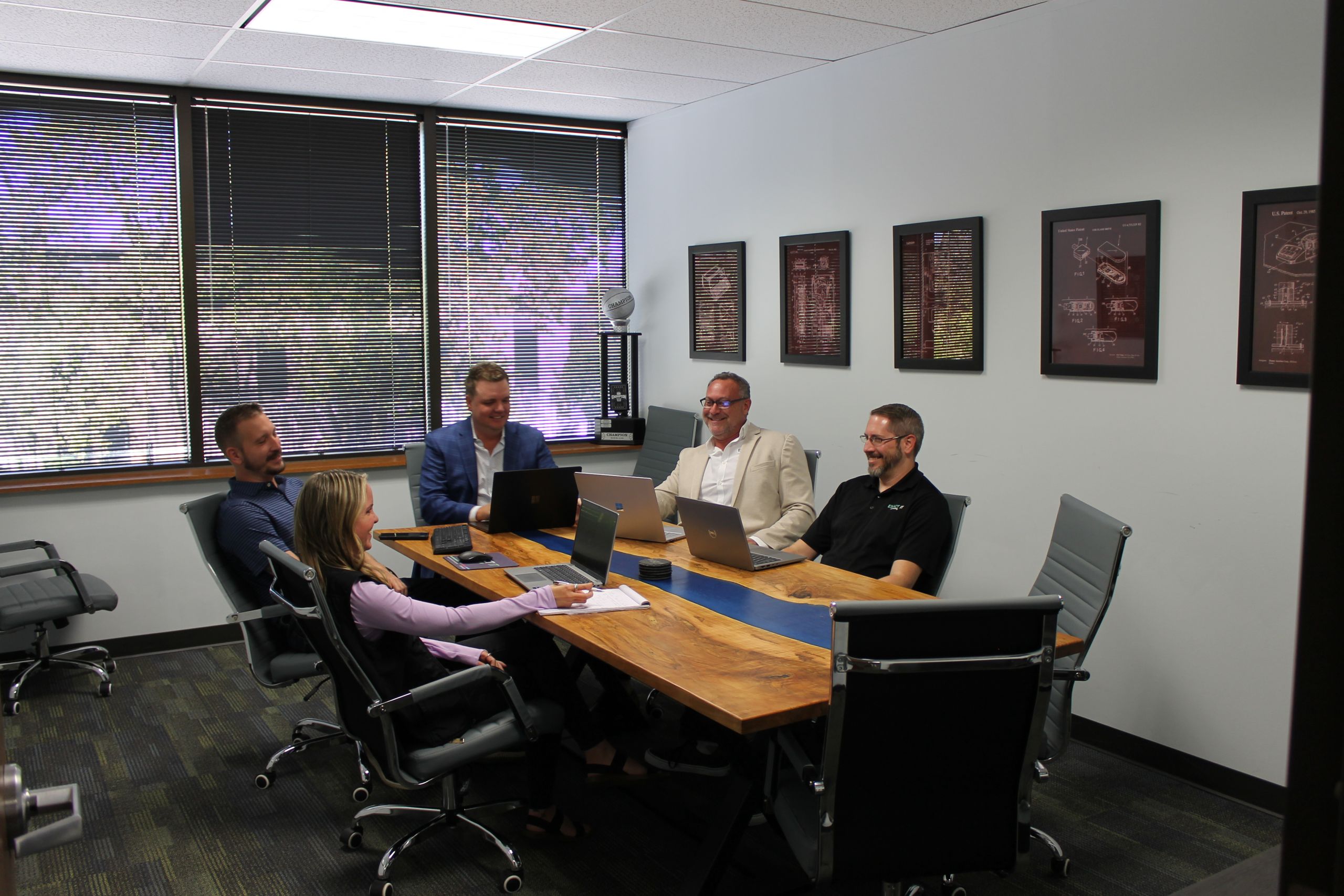 Exact IT Team sitting at the conference table.